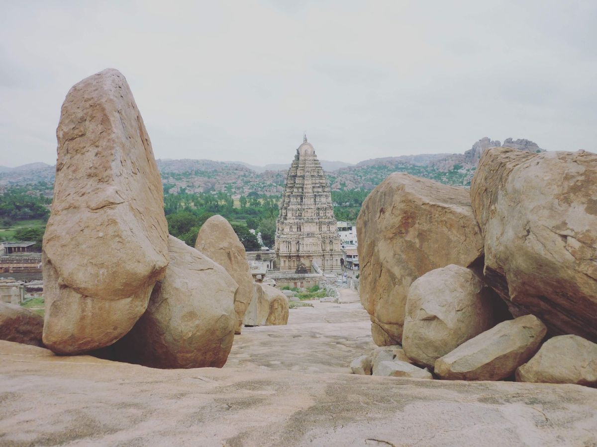 Hampi temple through boulders