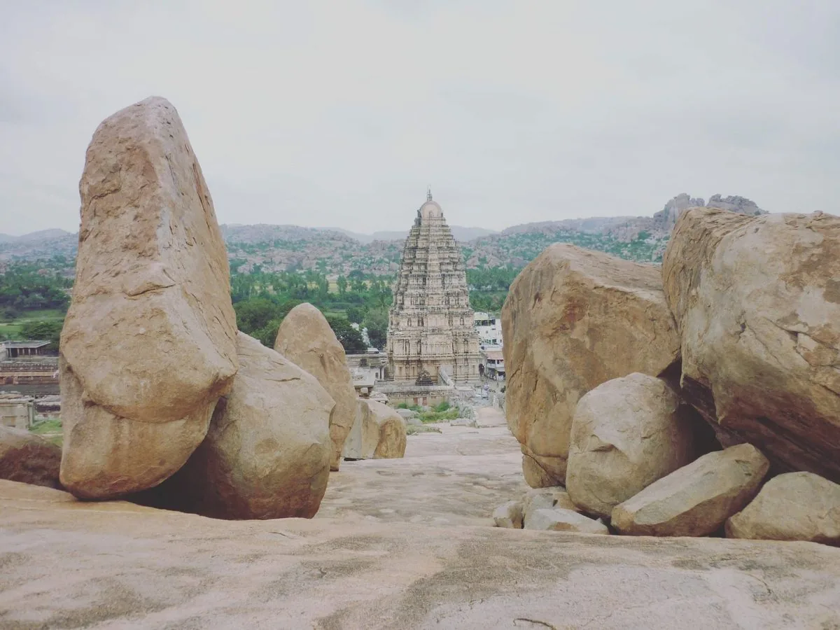 Hampi temple through boulders